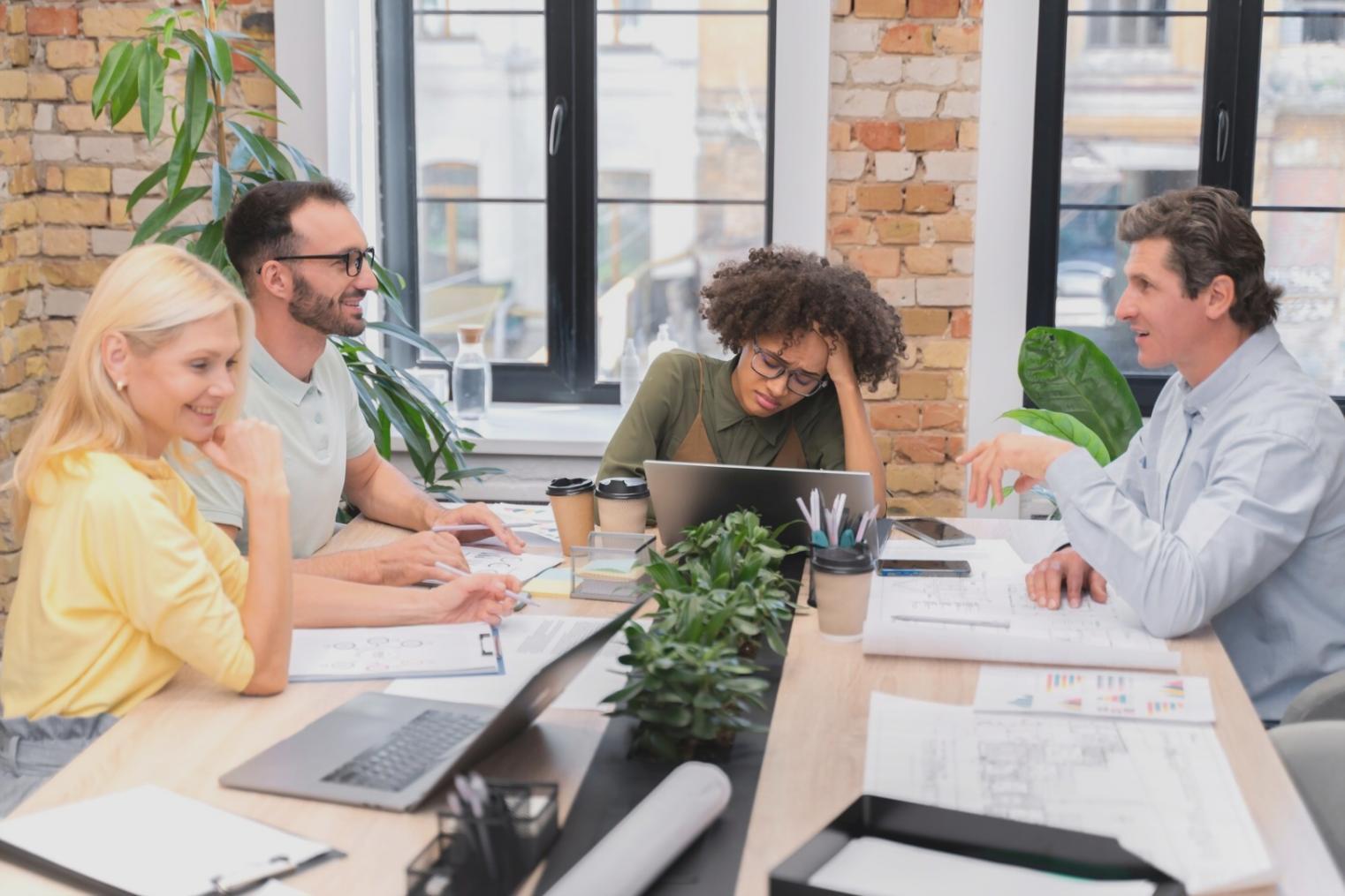 Corporate training session with team members collaborating on financial planning